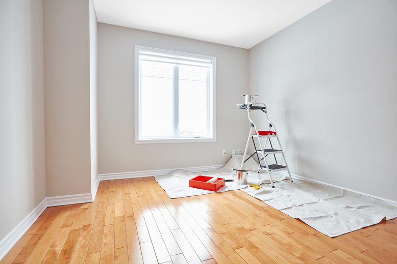 Bright interior room with freshly painted neutral gray walls
