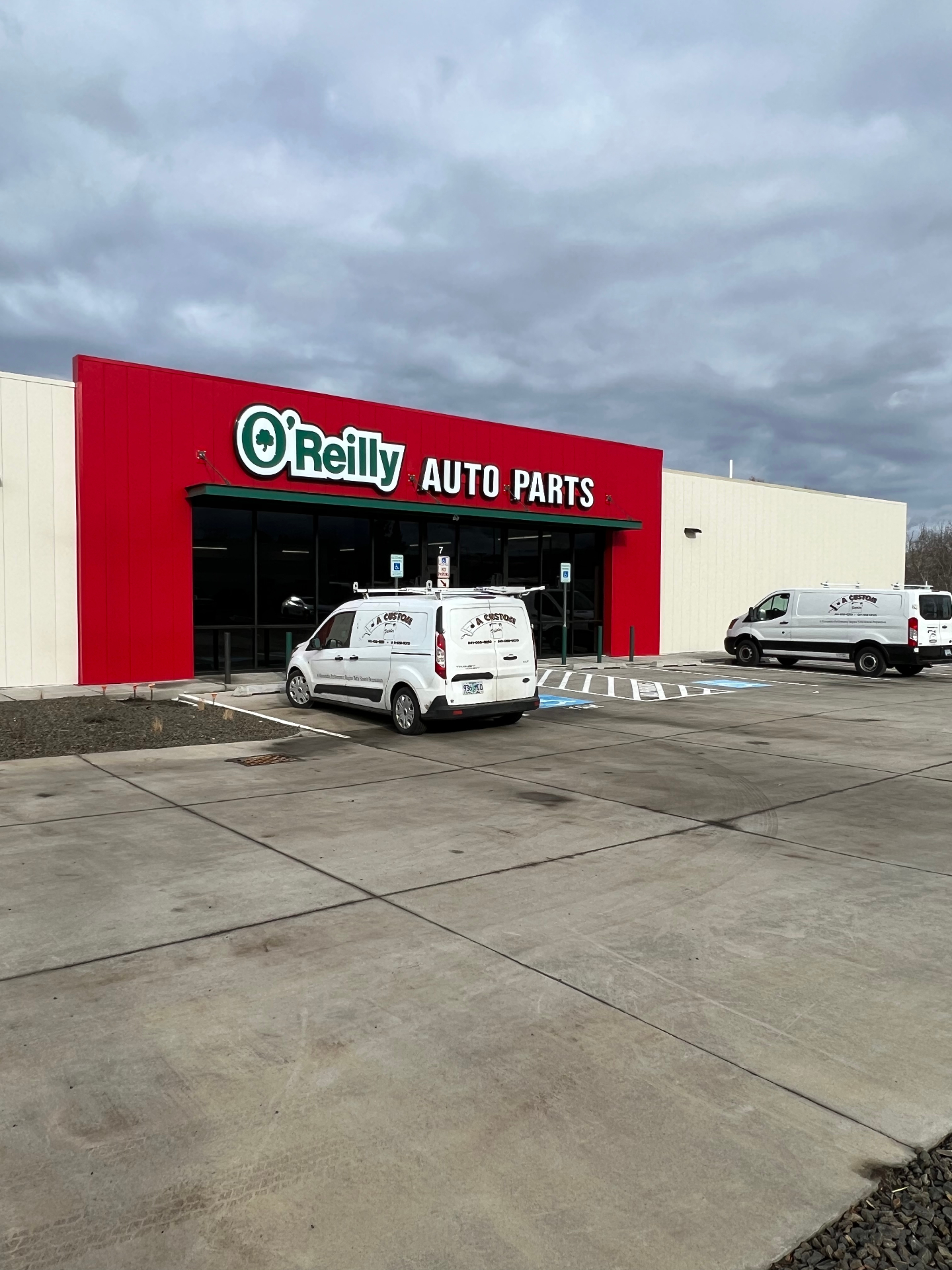 A Custom Painter vans at O'Reilly Auto Parts commercial repaint project