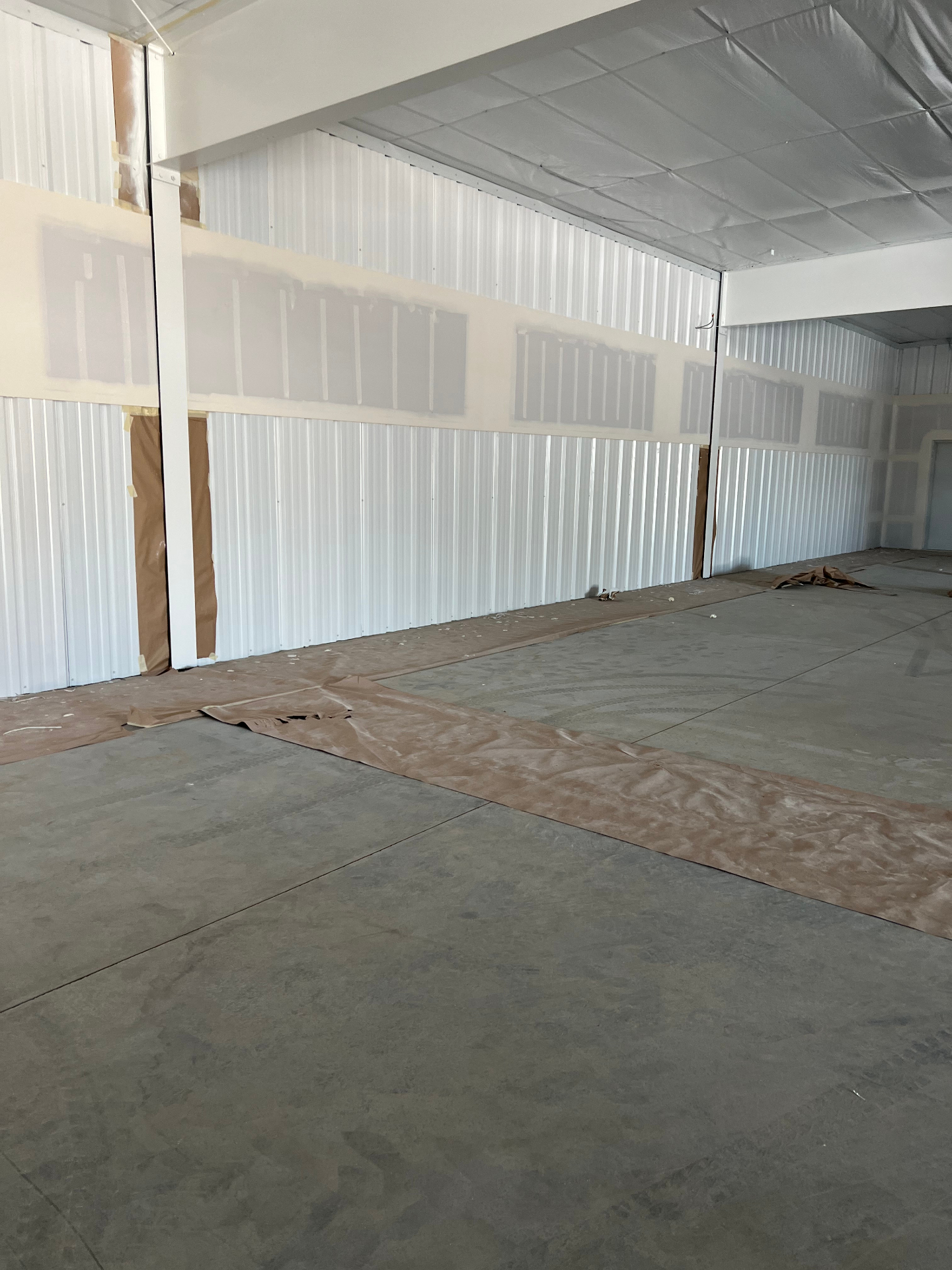 Freshly painted white commercial warehouse interior